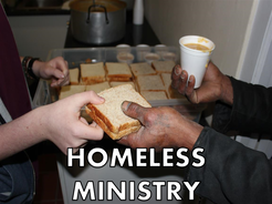 A homeless man being served a lunch